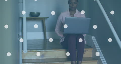 Focused Woman Using Laptop on Stairs with Overlay Design Concept