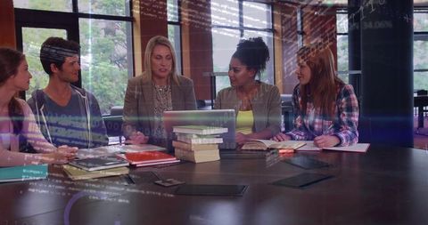 Mentor Facilitating Collaborative Study Session with Students