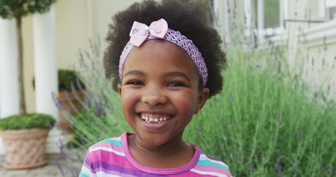 Cheerful African American Girl Smiling in Garden