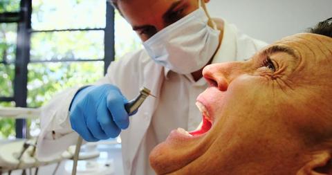 Dentist Treating Patient with Dental Drill - Download Free Stock Images Pikwizard.com