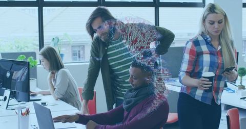 Coworkers collaborating in innovative open office in modern workplace