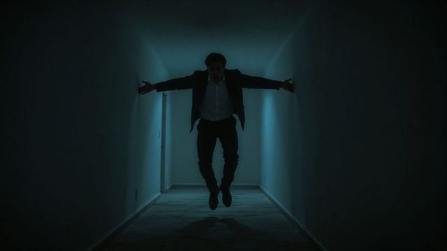 Mystical Businessman Suspended Mid-Air in Dim Corridor at Night