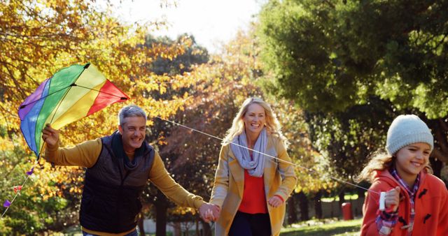 Happy Family Flying Kite in Autumn Park - Download Free Stock Images Pikwizard.com