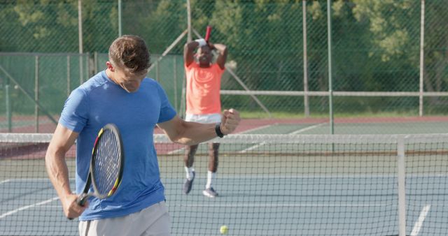 Men Playing Tennis Match Celebrating Victory on Court - Download Free Stock Images Pikwizard.com