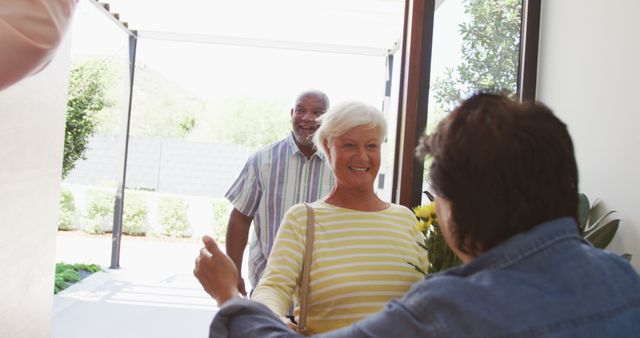 Senior Friends Reuniting with Warm Hugs at Home Entrance - Download Free Stock Images Pikwizard.com