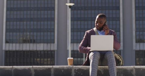 Businessman Balancing Technology and Leisure in Urban Environment