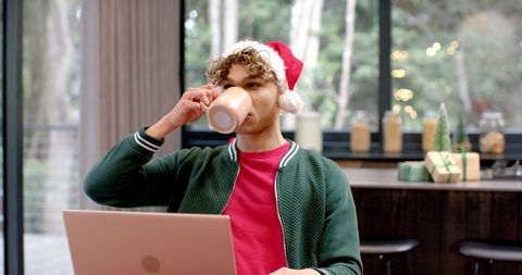 Young Man Enjoying Festive Holiday Home Atmosphere
