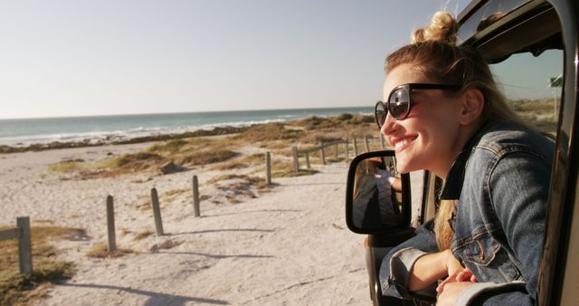 Happy Woman Enjoying Scenic Beach View from Car Window - Download Free Stock Images Pikwizard.com