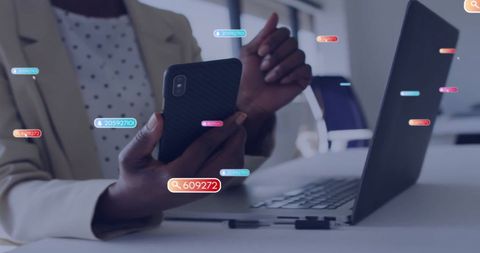 Businesswoman Analyzing Data with Tech Devices in Office