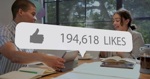 Coworkers celebrating viral post reaching 194,618 likes during sunlit collaborative meeting