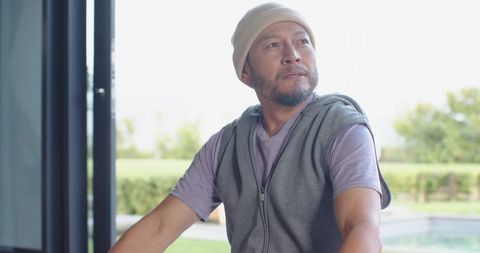 Thoughtful Senior Asian Man in Casual Wear by Poolside