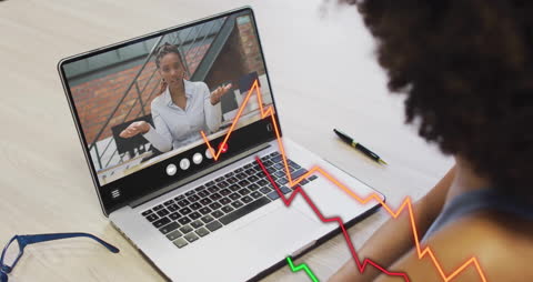 Virtual Meeting Analyzing Financial Graphs on Laptop Screen