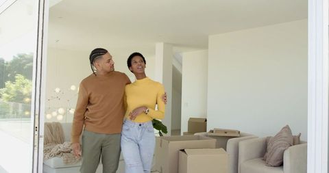 Happy Couple Moving Into New Home Embracing Excitement and Hope
