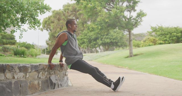 Man Exercising Outdoors with Park Background - Download Free Stock Images Pikwizard.com