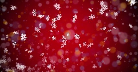 White snowflakes on red festive bokeh background
