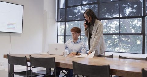 Diverse colleagues collaborating in modern conference room
