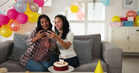 Mother Child Celebrating Birthday at Home with Cake and Balloons