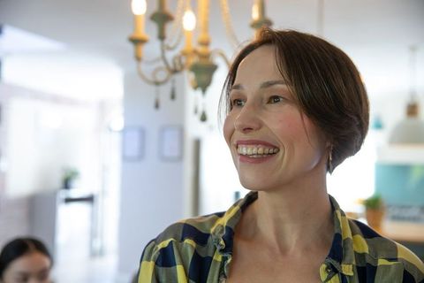 Happy Woman Smiling in Modern Home Interior
