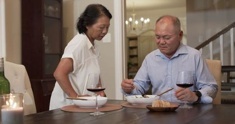 Senior Couple Enjoying Intimate Dinner at Home