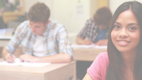 Diverse Students Completing Exams in Classroom