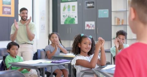 Teacher Engages Enthusiastically with Classroom Activity - Download Free Stock Images Pikwizard.com