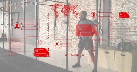 Leaning athlete showcasing red digital hud overlays in industrial gym with brick wall