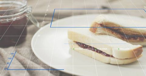 Displaying jam sandwich halves on white plate with AR grid overlay and rustic jar