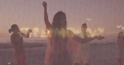 Friends Waving Sparklers at Sunset Beach Celebration