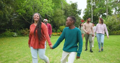 Diverse Family Strolling Outdoors During Holiday Celebration