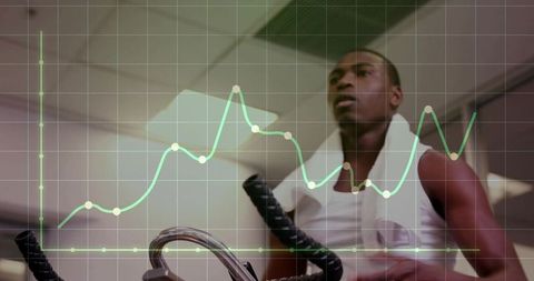 Man Exercising on Stationary Bike with Data Overlay in Gym