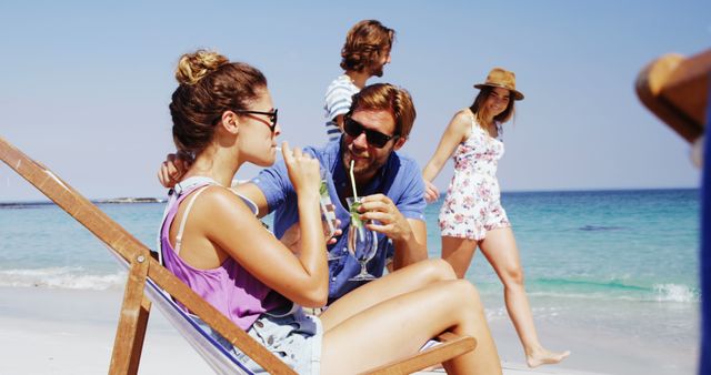 Friends Enjoying Refreshing Drinks at Sunny Beach - Download Free Stock Images Pikwizard.com