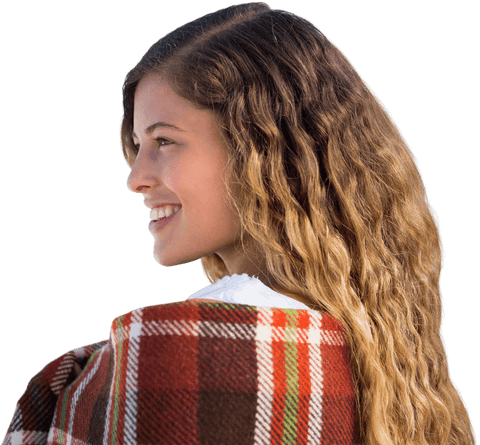 smiling woman with curly hair wrapped in plaid blanket - Download Free Stock Videos Pikwizard.com