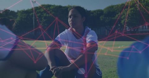 Athletes Huddling at Soccer Practice with Digital Network Overlay