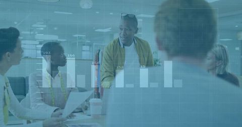 Design team collaborating on fashion samples in open-plan studio with analytics overlay