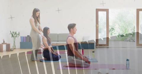Yoga Instructor Guiding Relaxation in Bright Studio