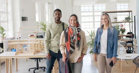 Diverse Group of Professionals Smiling Confidently at Office