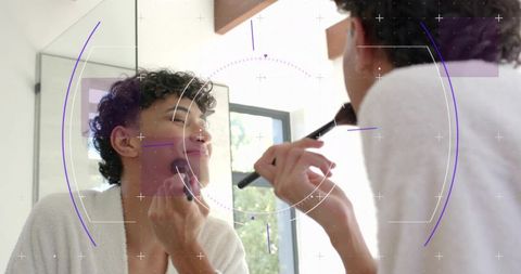 Man applying makeup at bathroom mirror with hud overlay, grooming routine in daylight