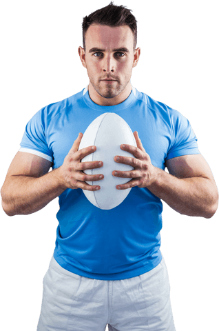 Rugby player holding ball and intense stare