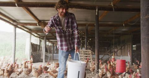 Smiling Farmer Feeding Chickens on Rustic Farm - Download Free Stock Images Pikwizard.com