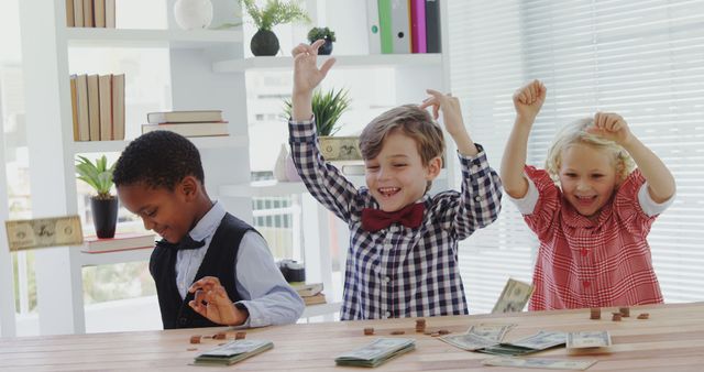 Diverse Group of Happy Children Counting Money at Table - Download Free Stock Images Pikwizard.com