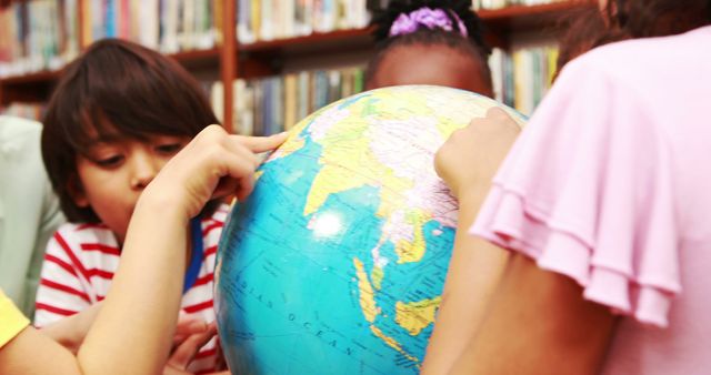 Curious Children Exploring World Globe Together in Library - Download Free Stock Images Pikwizard.com