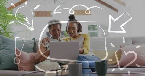 Mother and daughter browsing laptop on sofa in cozy living room with hand-drawn doodles