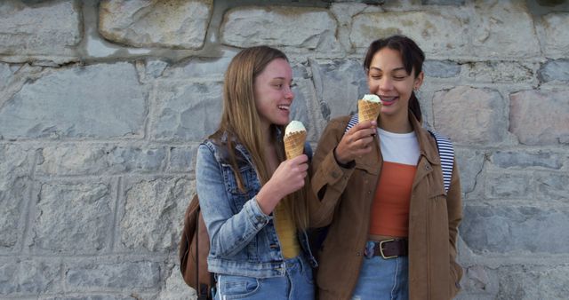 Two Friendly Young Women Enjoying Ice Cream Together - Download Free Stock Images Pikwizard.com