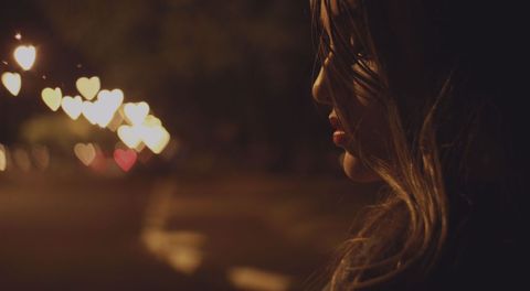 Contemplative Woman With Heart Shaped Bokeh Lights