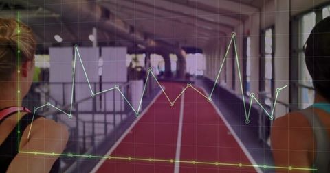 Athletes tracking performance on indoor running track with data overlay and analytics