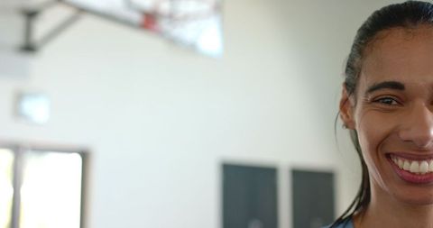 Energetic African American Woman Smile on Indoor Gym Court