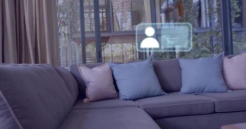 Featuring modern l-shaped sectional sofa with pastel pillows, glass doors and ui overlay