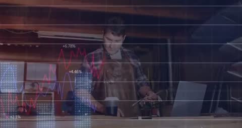 Craftsman in Workshop Analyzing Digital Metrics on Laptop