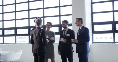 Business Professionals Coffee Break Discussing in Bright Work Environment - Download Free Stock Images Pikwizard.com
