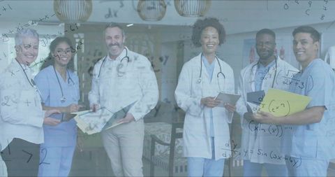 Diverse medical team analyzing patient data with technology